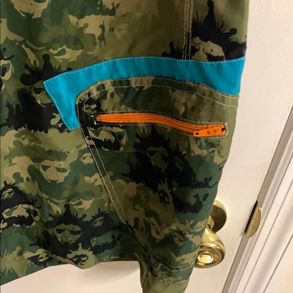Live Mechanics Green/Blue Board Shorts with Drawstring Waist Camo Lion design.